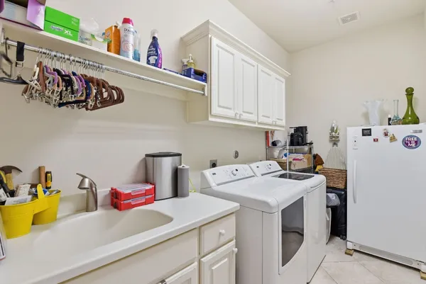a view of storage and utility room with washer and dryer