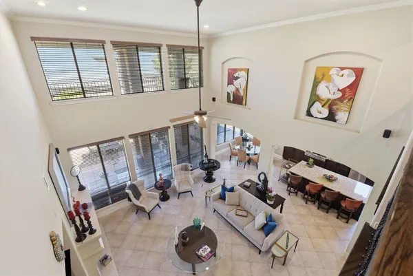 a very nice looking living room with furniture and floor to ceiling window