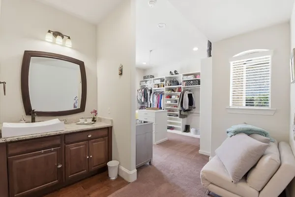 a en suite bathroom with a toilet sink and mirror