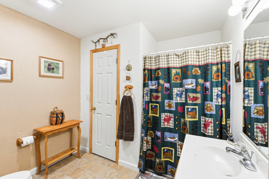 66 Fortenberry Road Young Harris, GA 30582 - Photo 35 of 55 a view of walk in closet with clothes and shoes