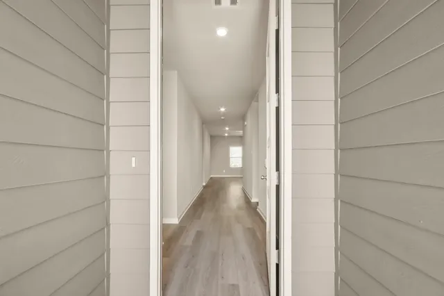 a view of a bathroom from a hallway