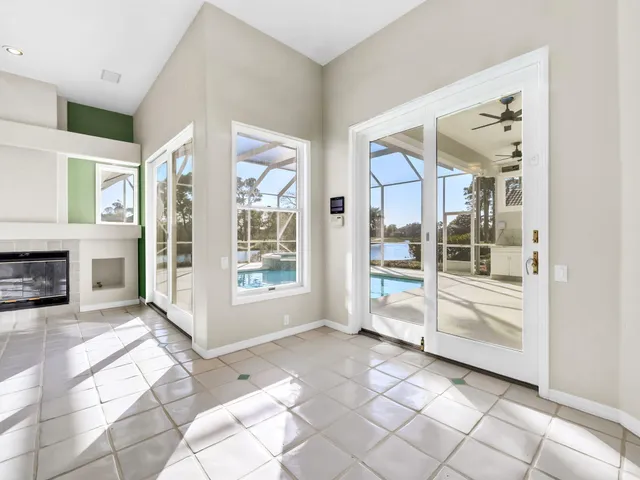 a view of a kitchen with white cabinets and a wooden floor