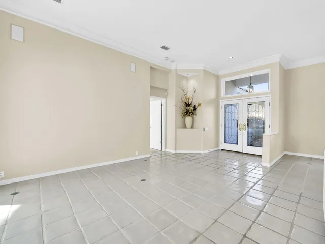 a view of an empty room with a balcony