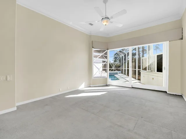 a spacious bathroom with a granite countertop sink and a mirror