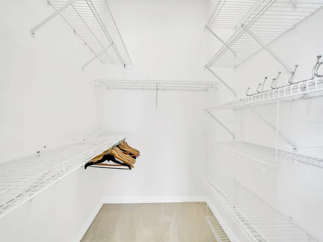 a view of an empty room and a window