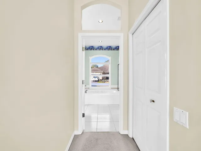 a spacious bathroom with a sink and a mirror