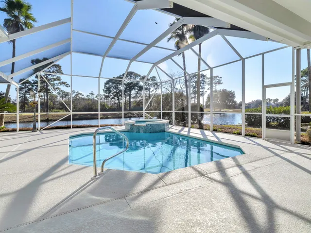 a view of a house with a yard and roof