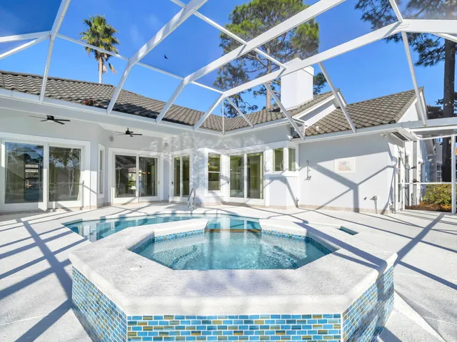 a view of a house with a small yard and plants