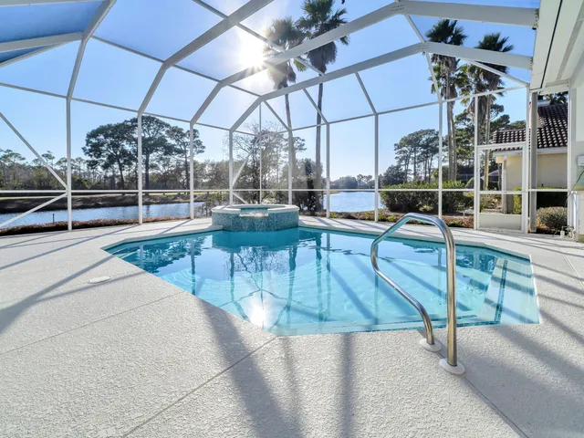a view of a patio with a table and chairs