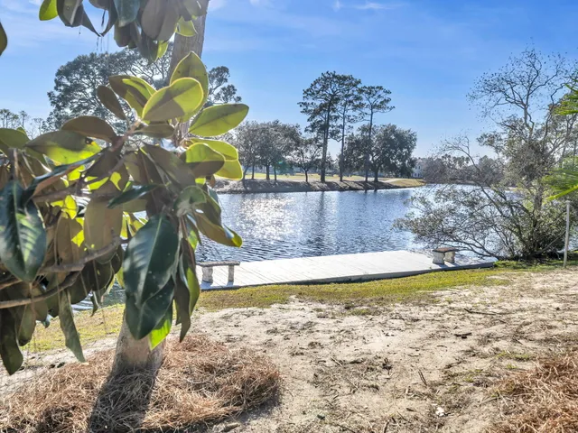 an aerial view of a houses with a yard