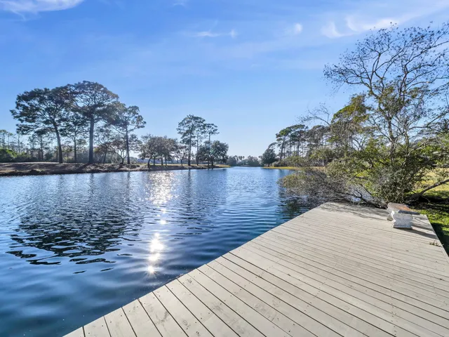 an aerial view of a house swimming pool and outdoor seating