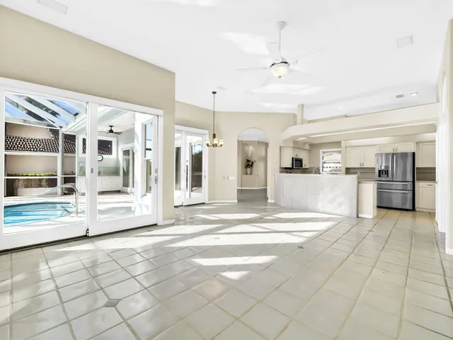 a kitchen with stainless steel appliances a refrigerator sink and microwave