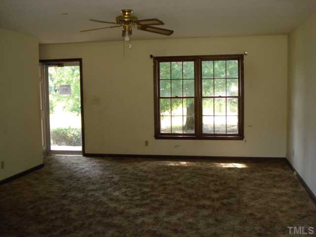 2528 Edgemont Road Wendell, NC 27591 - Photo 2 of 9 an empty room with windows
