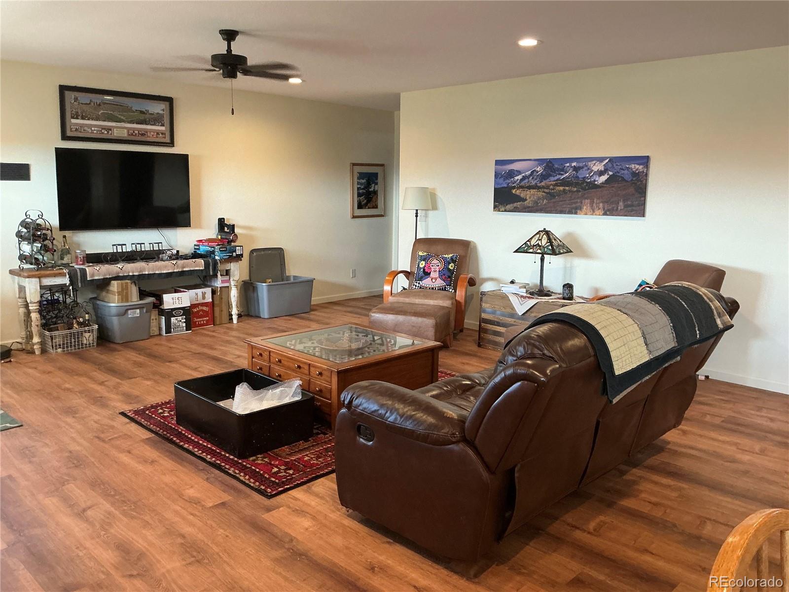 406-449 Schierl Road Fort Garland, CO 81133 - Photo 36 of 50 a living room with furniture and a flat screen tv