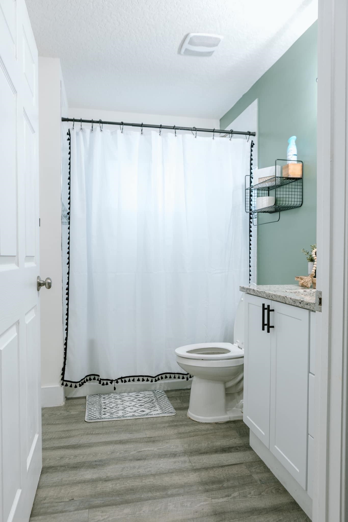 1148 Prince Road St. Augustine, FL 32086 - Photo 11 of 12 a bathroom with a sink and a mirror