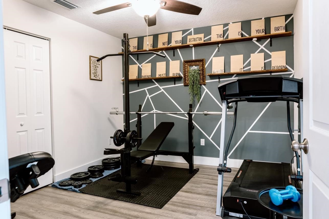 1148 Prince Road St. Augustine, FL 32086 - Photo 10 of 12 a room with gym equipment and wooden floor
