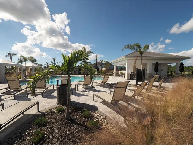 a view of a patio with chairs and tables