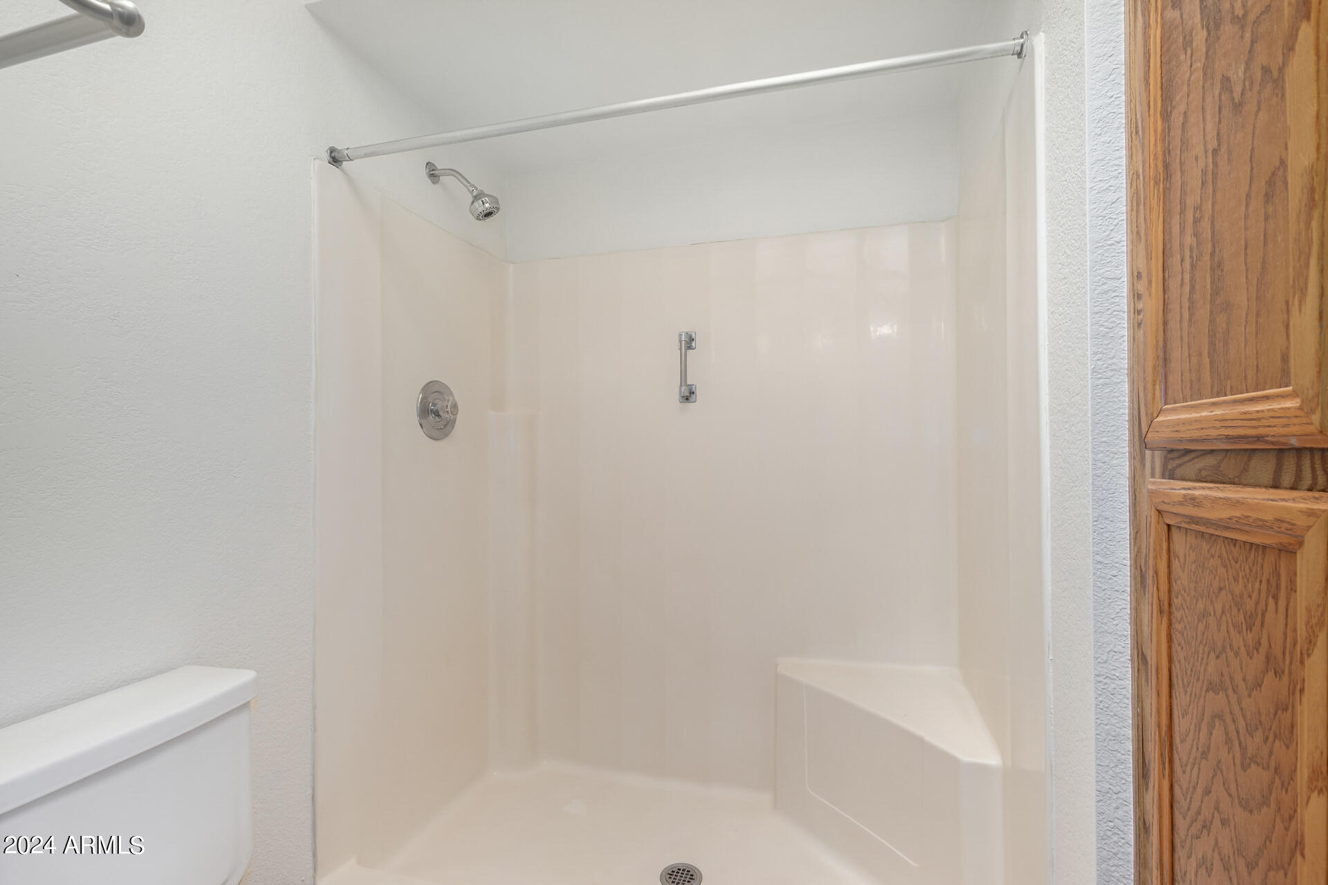 18035 North 24th Place Phoenix, AZ 85032 - Photo 11 of 22 a bathroom with a shower and a toilet