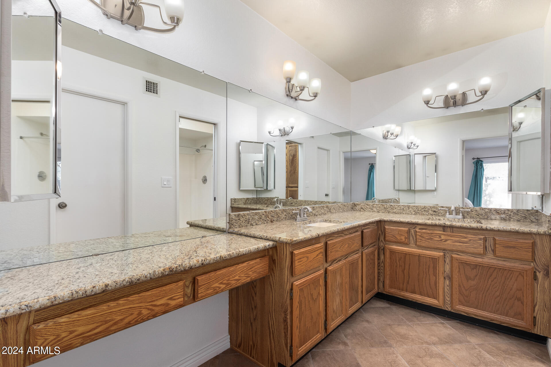 18035 North 24th Place Phoenix, AZ 85032 - Photo 12 of 22 a bathroom with a granite countertop sink and a mirror