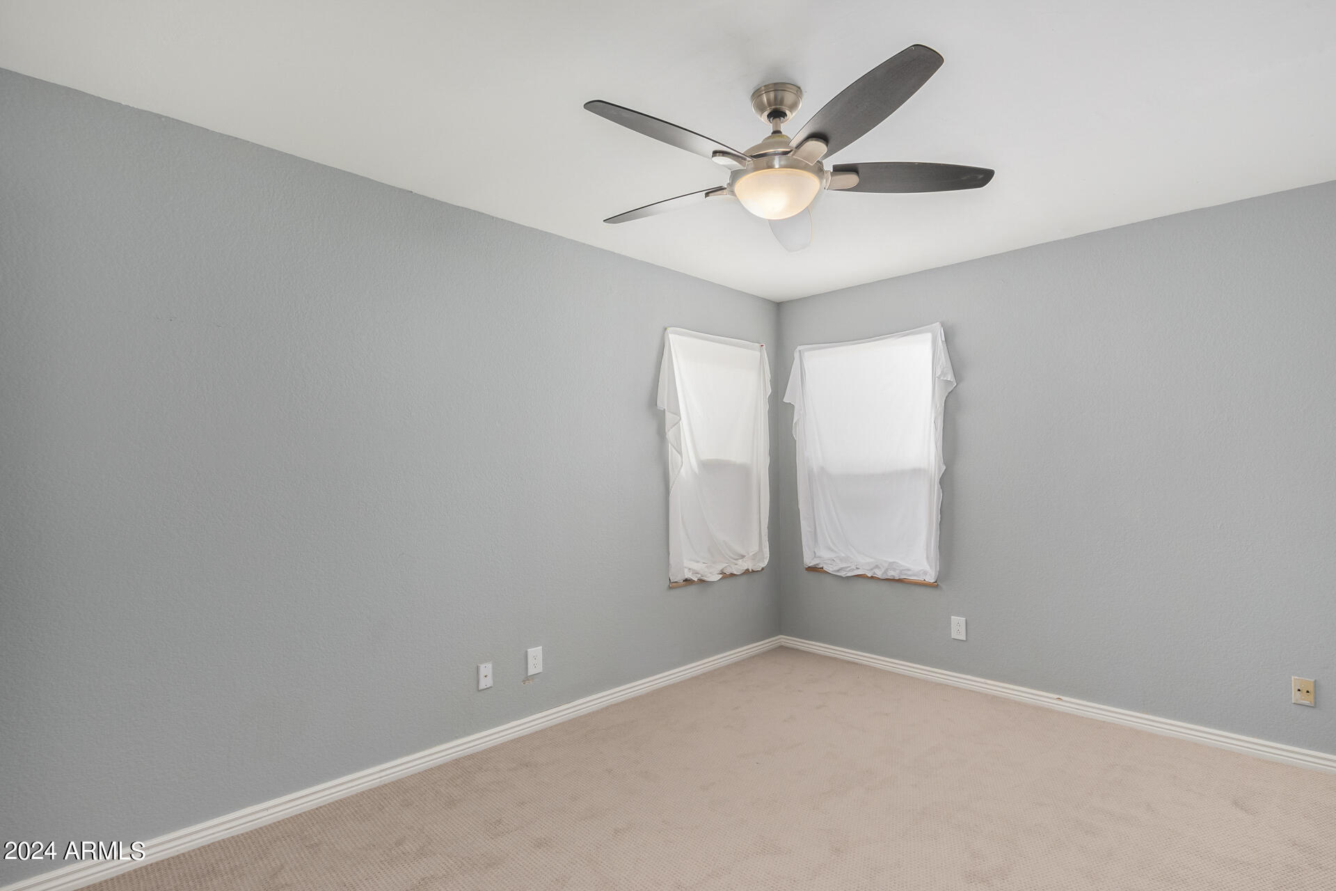 18035 North 24th Place Phoenix, AZ 85032 - Photo 14 of 22 an empty room with a window and a fan