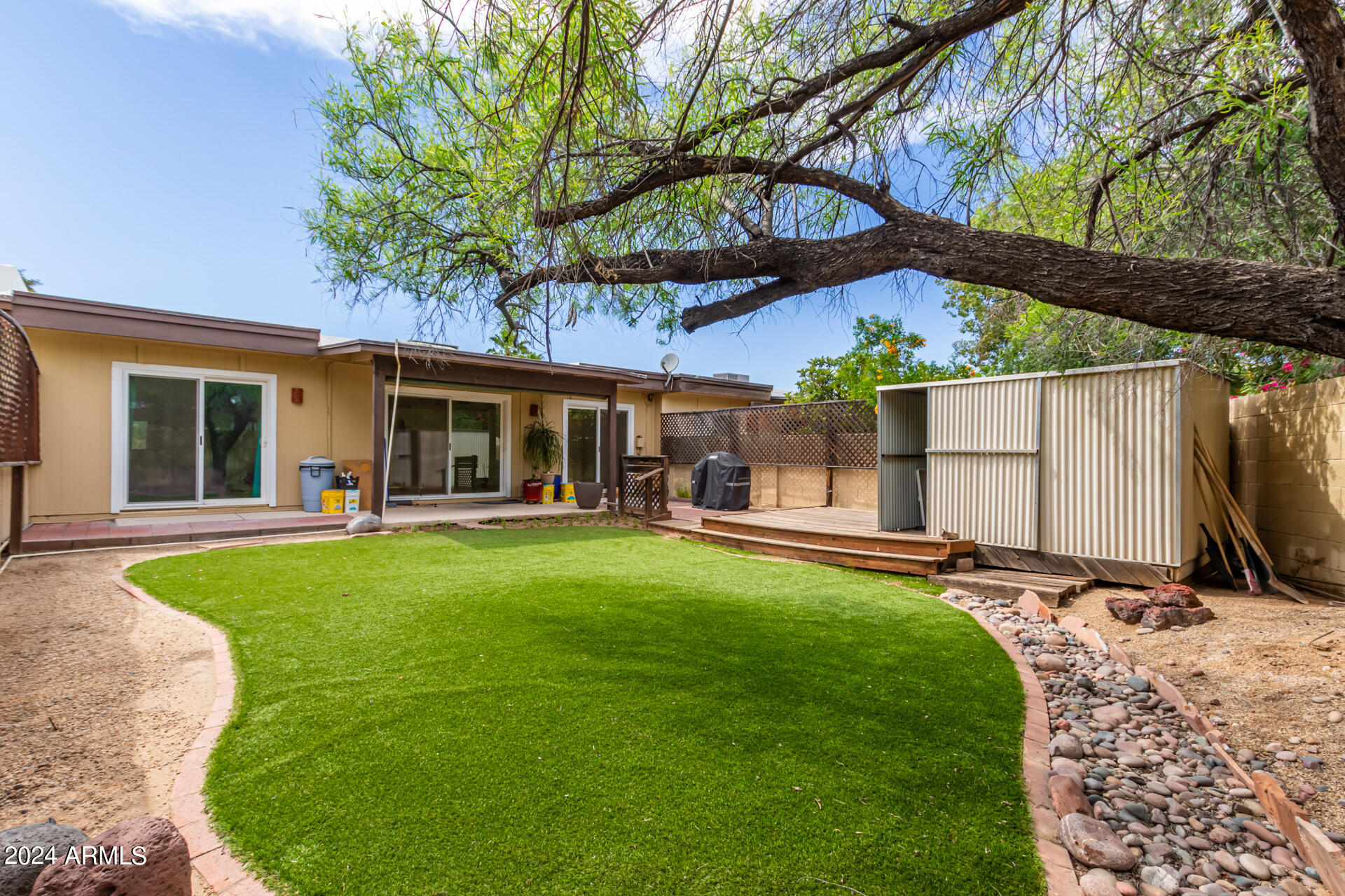 18035 North 24th Place Phoenix, AZ 85032 - Photo 20 of 22 a view of a house with a backyard