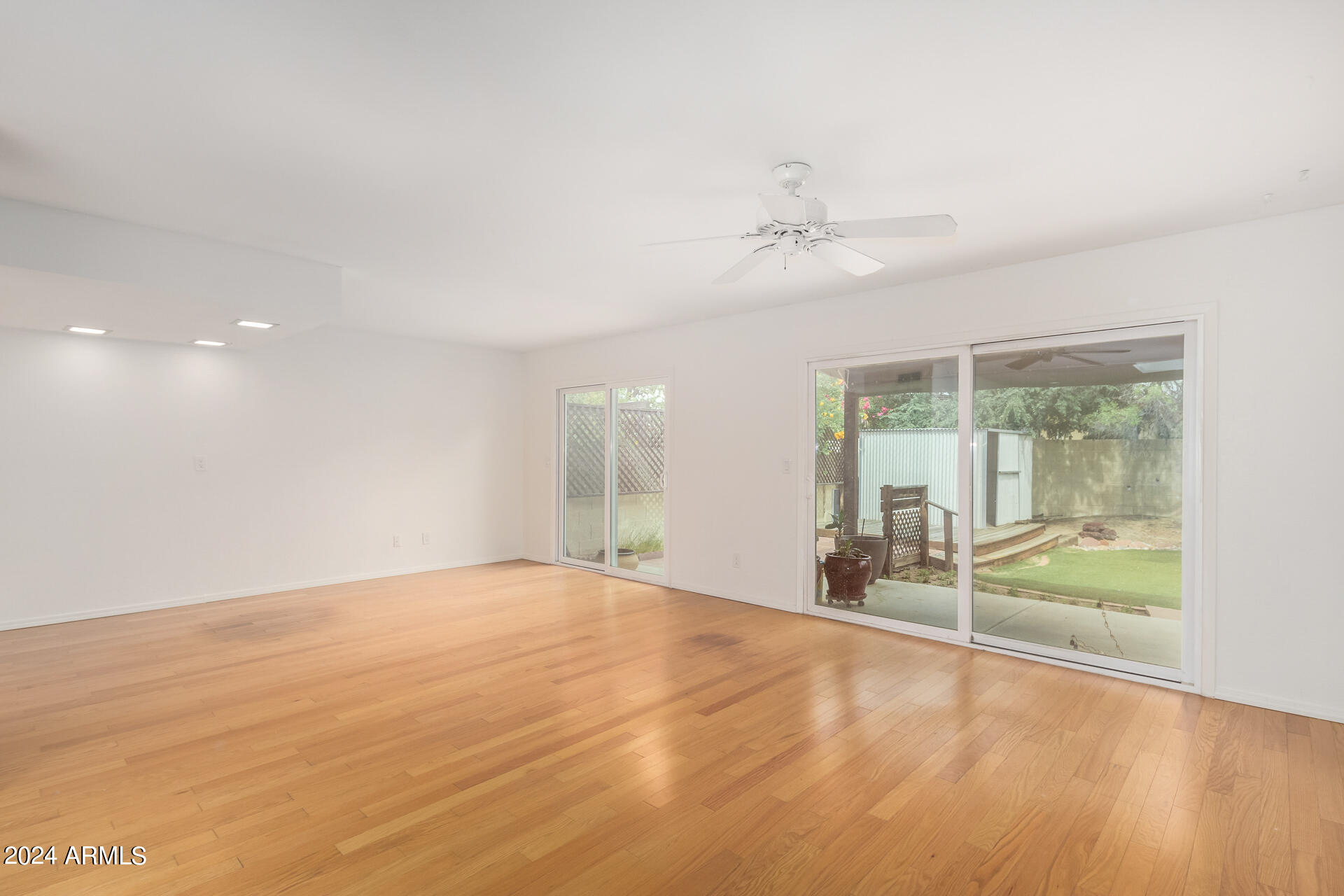18035 North 24th Place Phoenix, AZ 85032 - Photo 2 of 22 a view of an empty room with a window