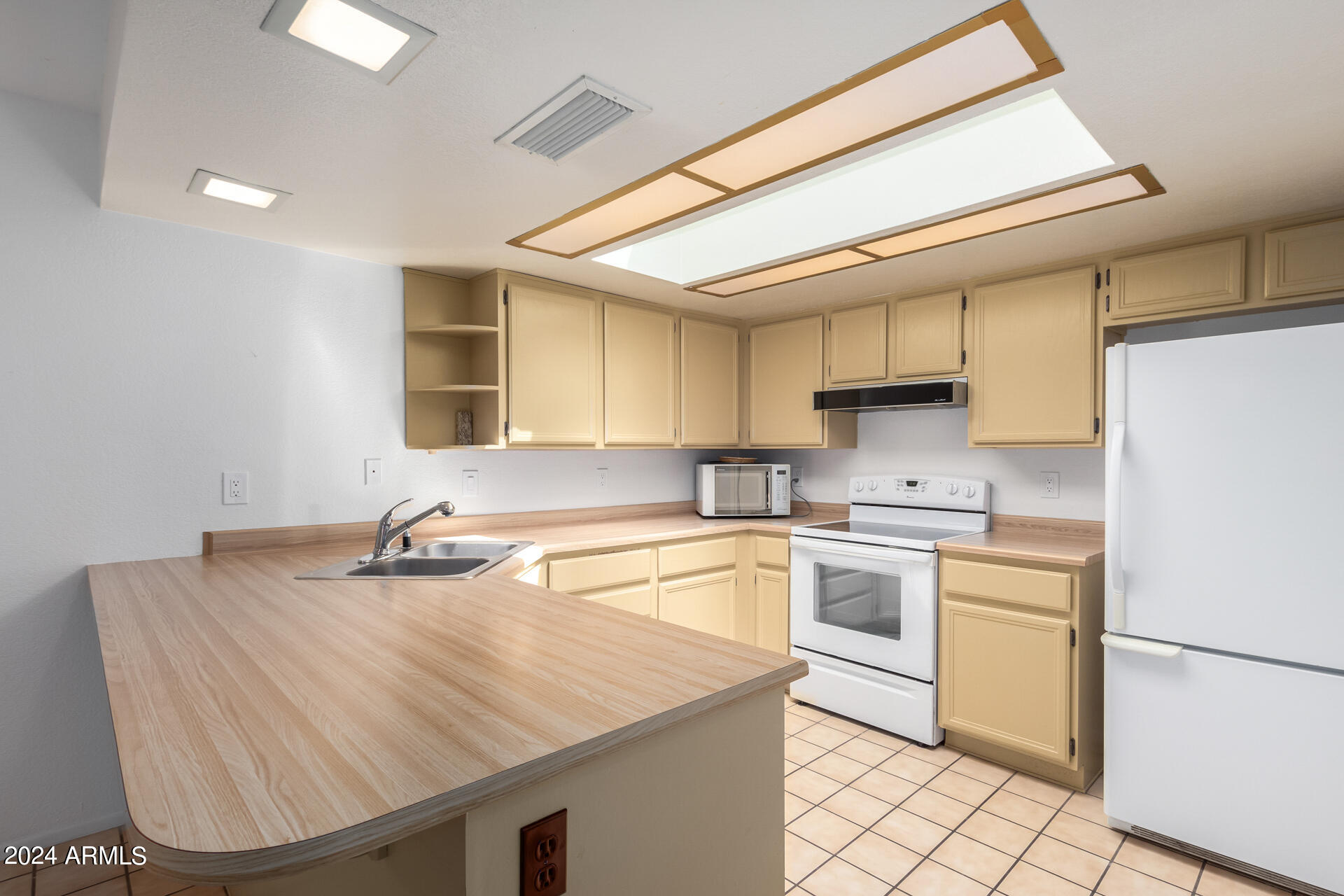18035 North 24th Place Phoenix, AZ 85032 - Photo 8 of 22 a kitchen with a sink appliances and cabinets