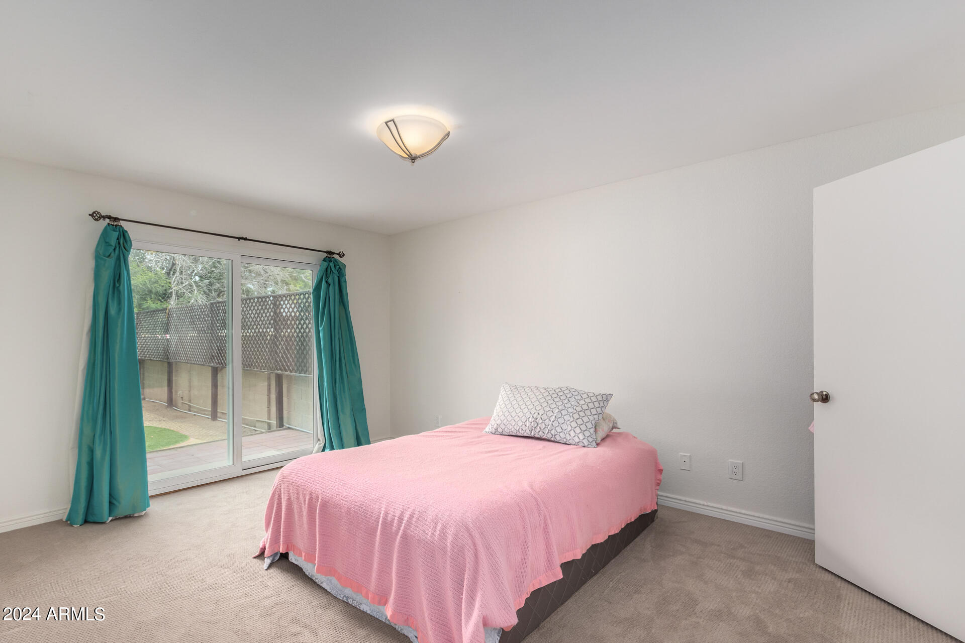 18035 North 24th Place Phoenix, AZ 85032 - Photo 9 of 22 a bedroom with a bed and window