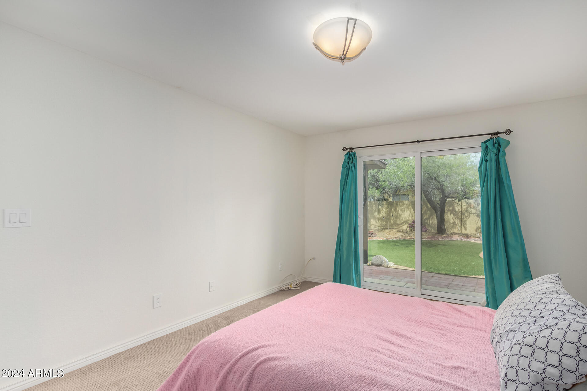 18035 North 24th Place Phoenix, AZ 85032 - Photo 10 of 22 a bedroom with a bed and a window