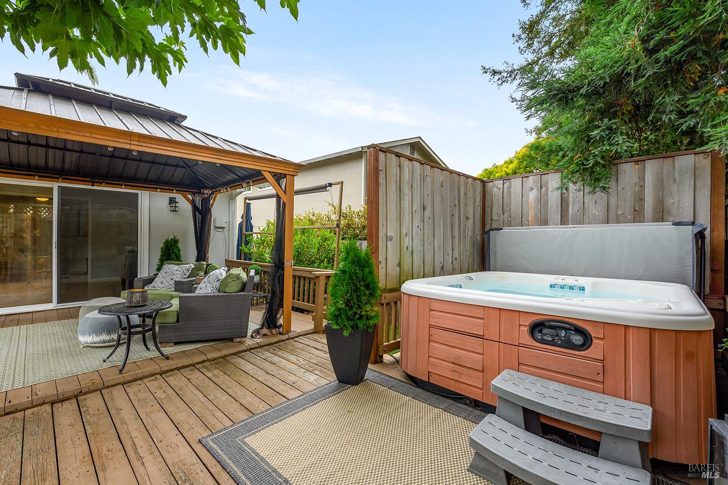 5313 Yerba Buena Road Santa Rosa, CA 95409 - Photo 22 of 34 Unwind in the private hot tub, thoughtfully tucked into its own secluded nook for added privacy and relaxation.