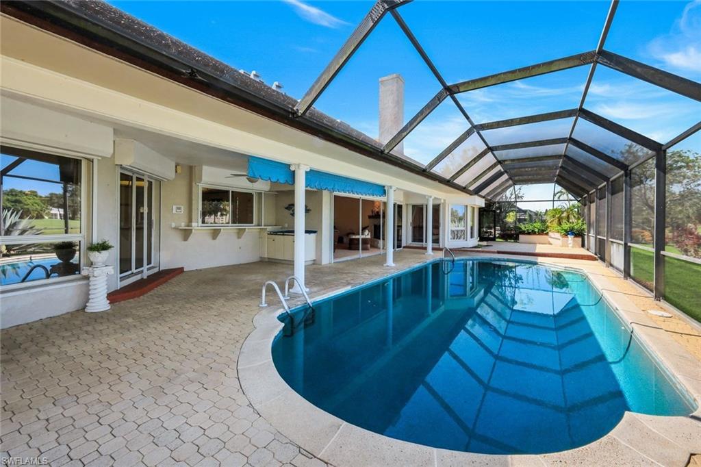 2227 Regal Way Naples, FL 34110 - Photo 23 of 34 Pool and Lanai Area