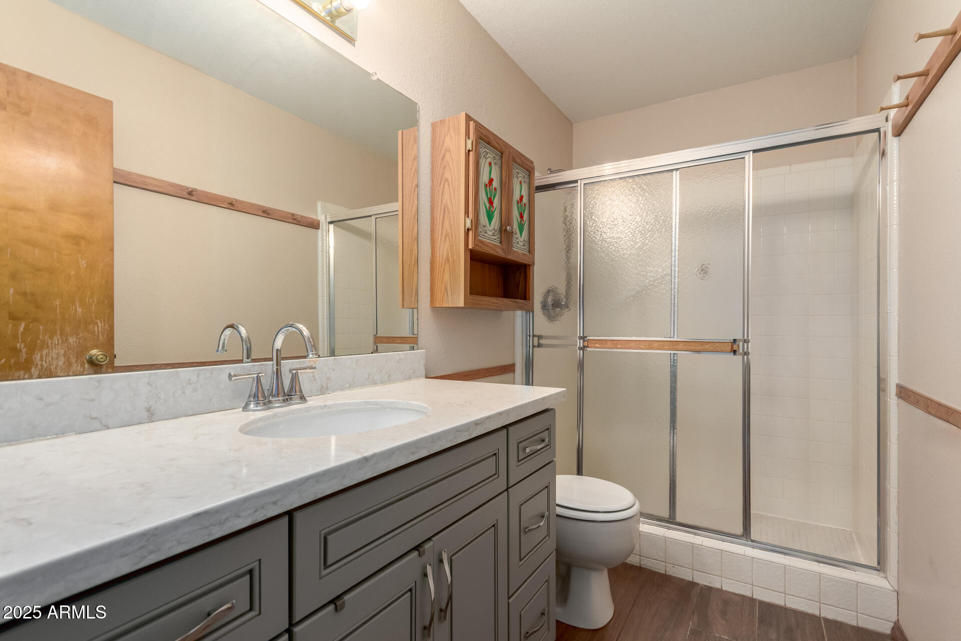 542 South Higley Road, Unit 3 Mesa, AZ 85206 - Photo 14 of 33 a bathroom with a sink toilet a mirror and shower