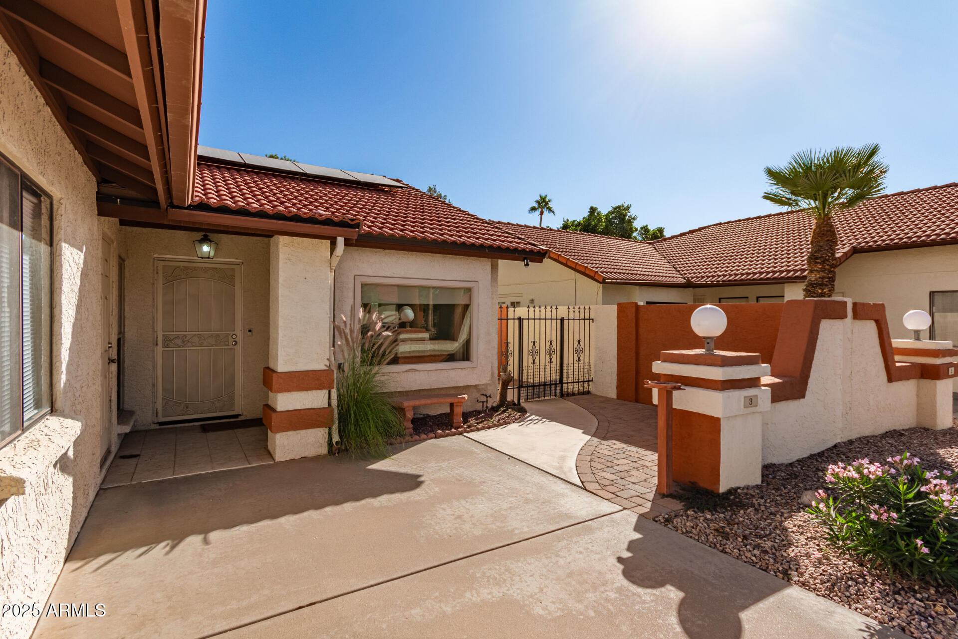 542 South Higley Road, Unit 3 Mesa, AZ 85206 - Photo 2 of 33 a view of a patio with table and chairs and potted plants
