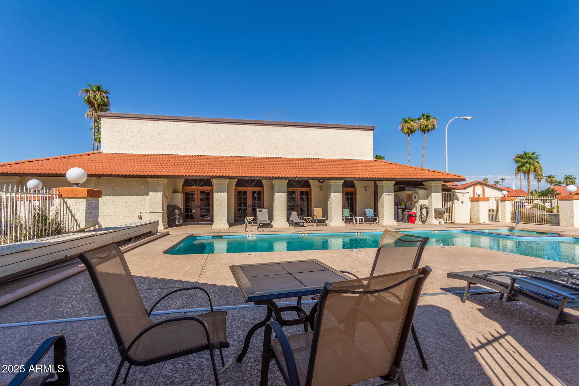 542 South Higley Road, Unit 3 Mesa, AZ 85206 - Photo 27 of 33 a view of a house with backyard sitting area and furniture