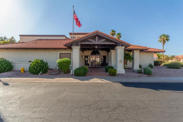 a swimming pool with a bench in patio