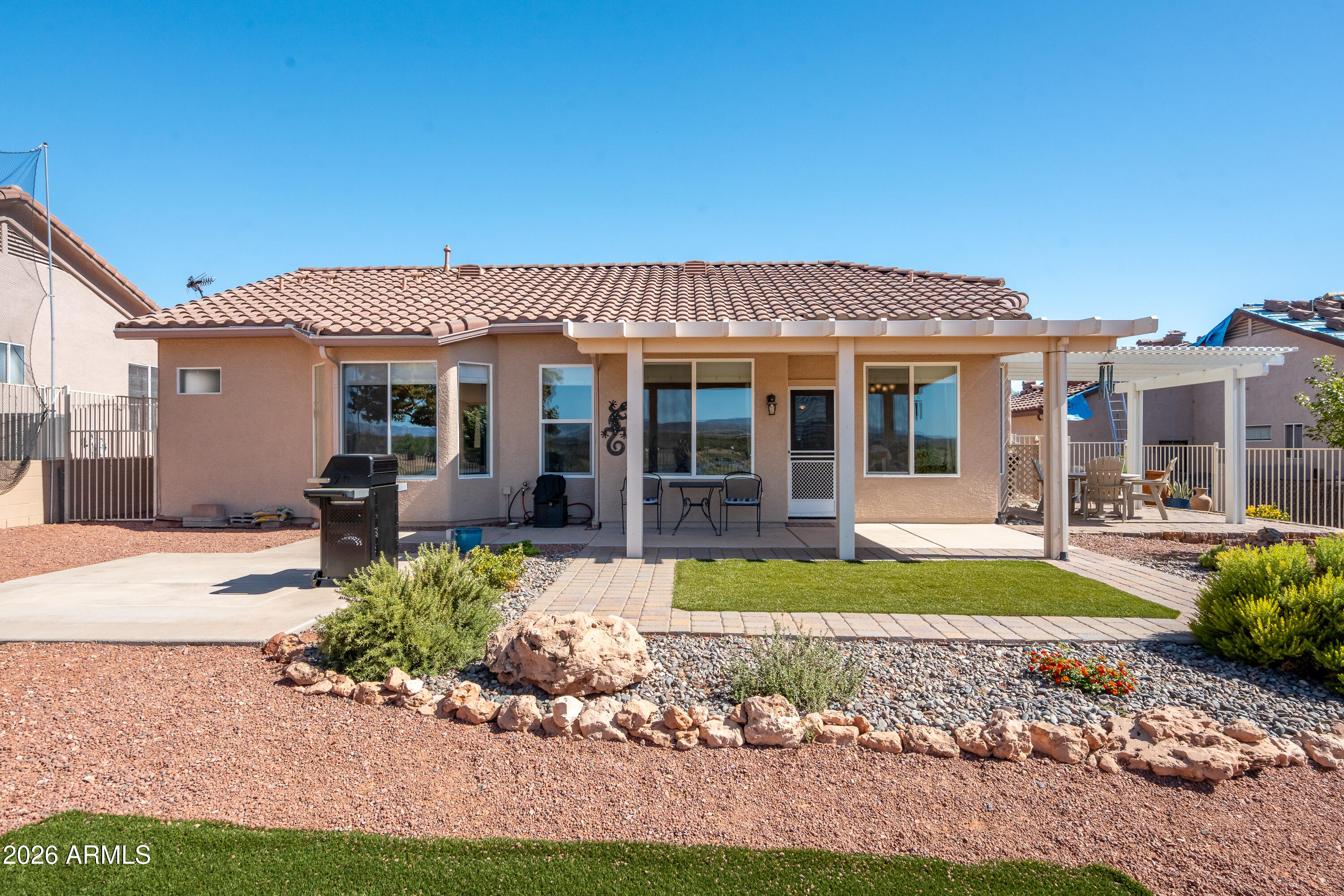 718 South Wandering River Road Cornville, AZ 86325 - Photo 30 of 41 a front view of a house with swimming pool and porch