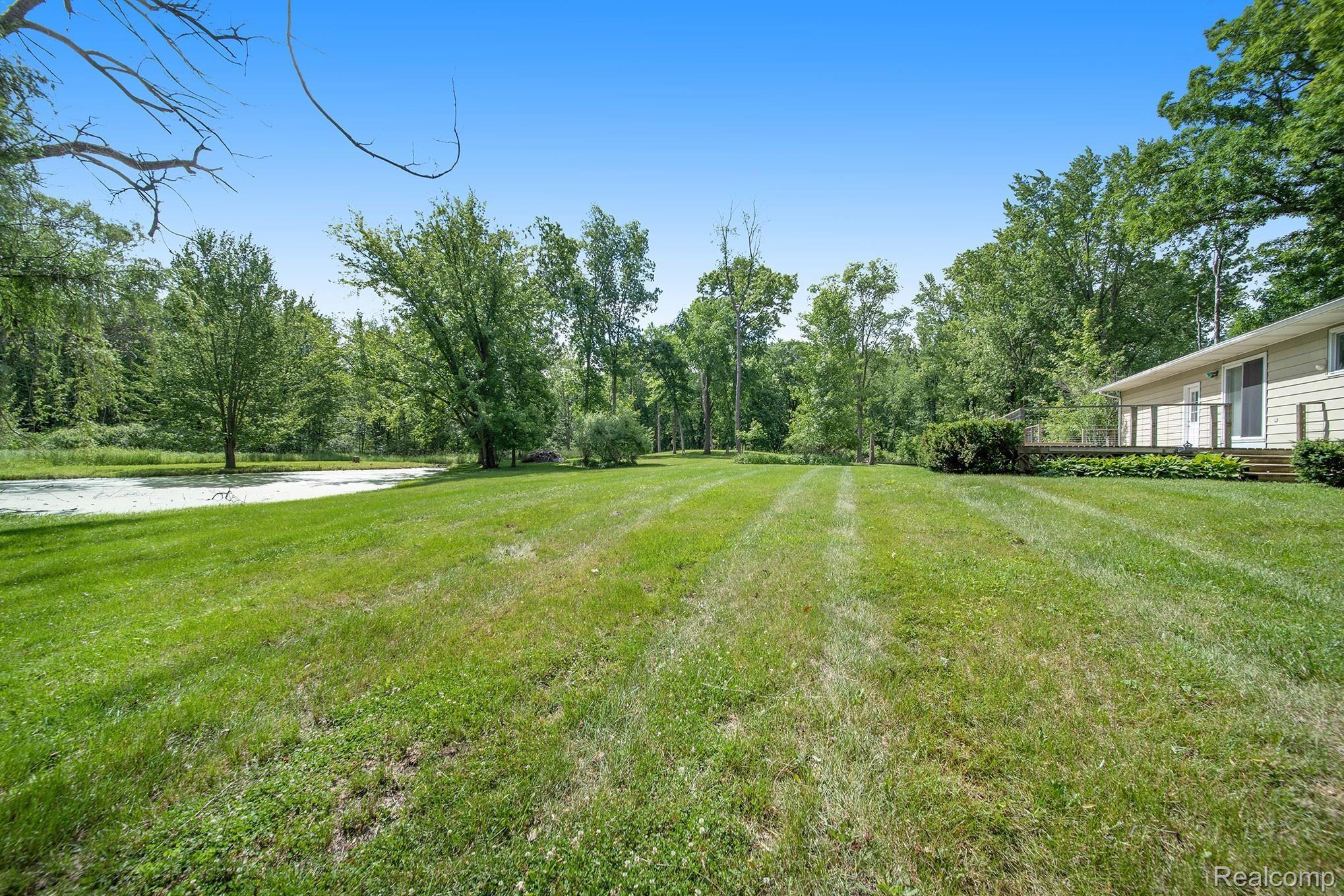 3677 Gregory Road Gregory, MI 48137 - Photo 22 of 23 Add a fountain and the pond will be lovely.