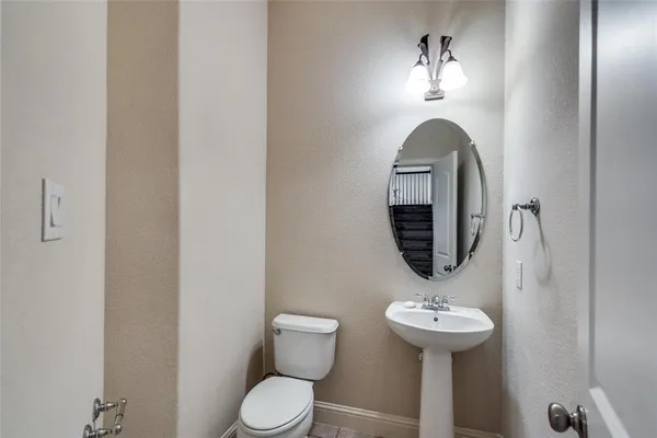 a kitchen with kitchen island granite countertop a stove and a sink
