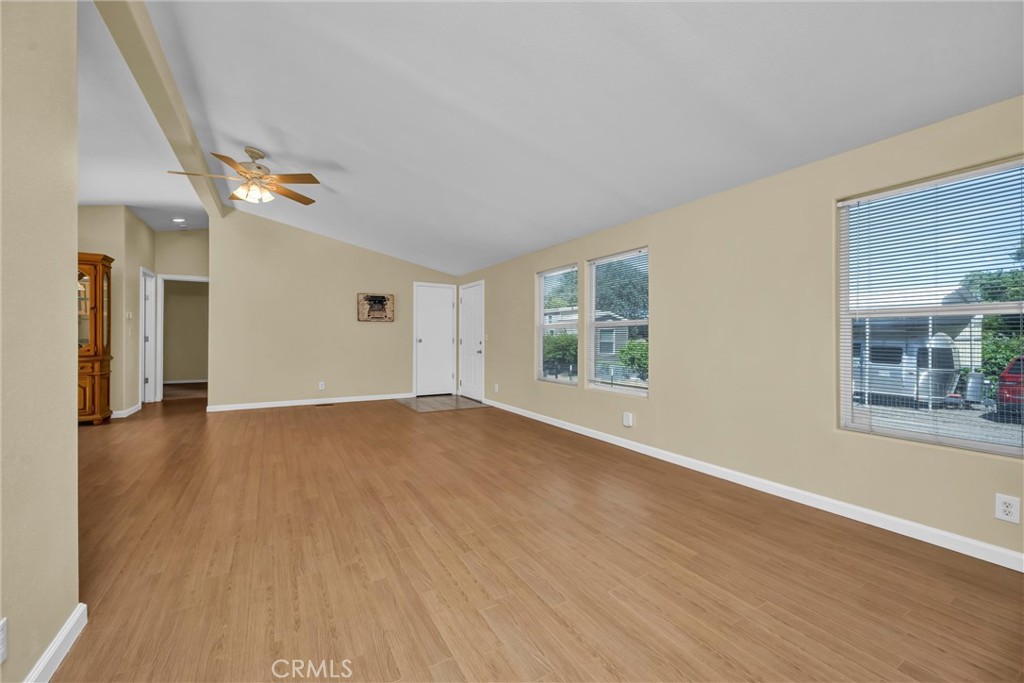 16410 Tish-A-Tang Road Lower Lake, CA 95457 - Photo 16 of 48 an empty room with wooden floor and windows