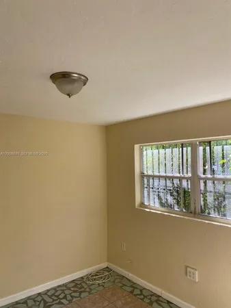 a view of a room with a large window