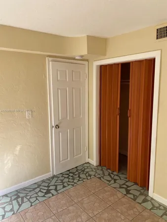 a view of a room with wooden walls