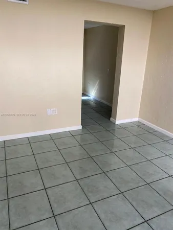 a view of an empty room and window