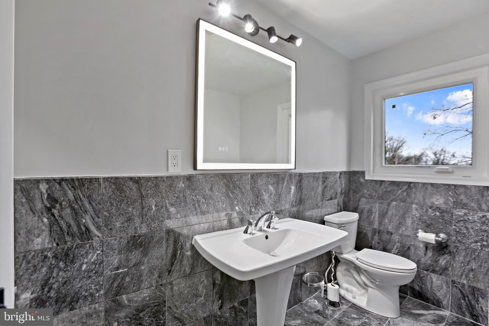 3906 Ridge Road Annandale, VA 22003 - Photo 12 of 34 Sleek modern bathroom with elegant finishes.
