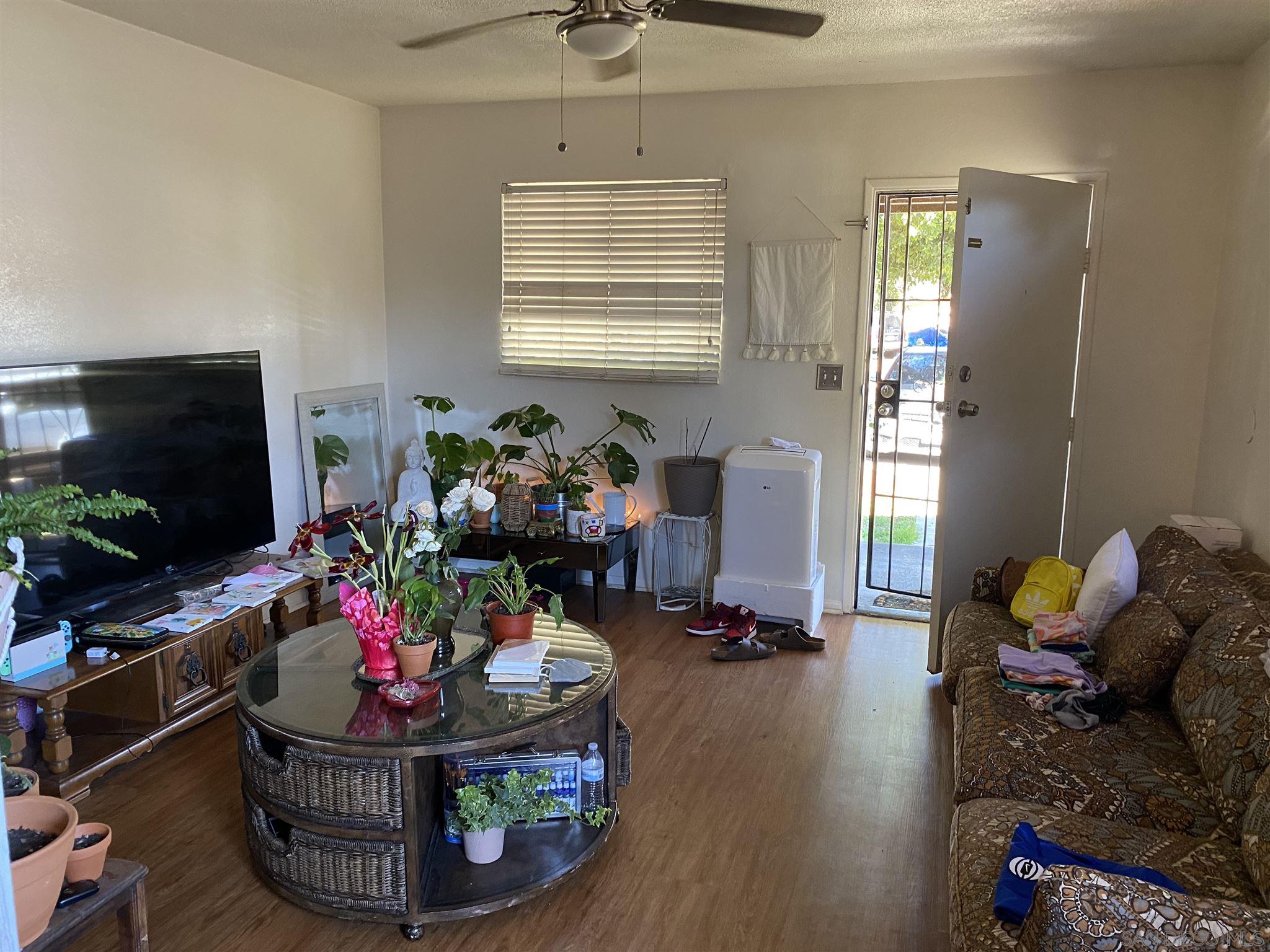 1141 Sumner Avenue El Cajon, CA 92021 - Photo 14 of 32 a living room with furniture and a flat screen tv