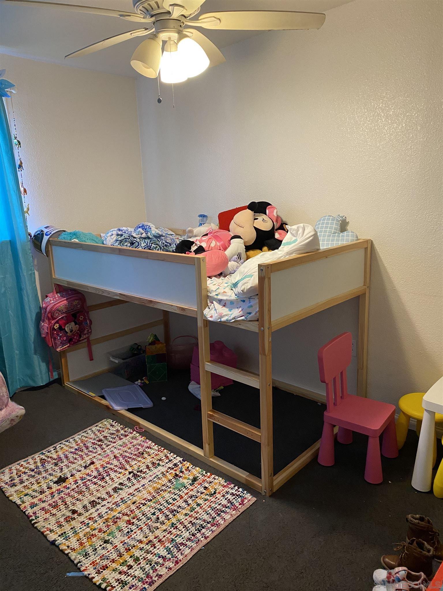 1141 Sumner Avenue El Cajon, CA 92021 - Photo 18 of 32 a bedroom with a bed and a dresser