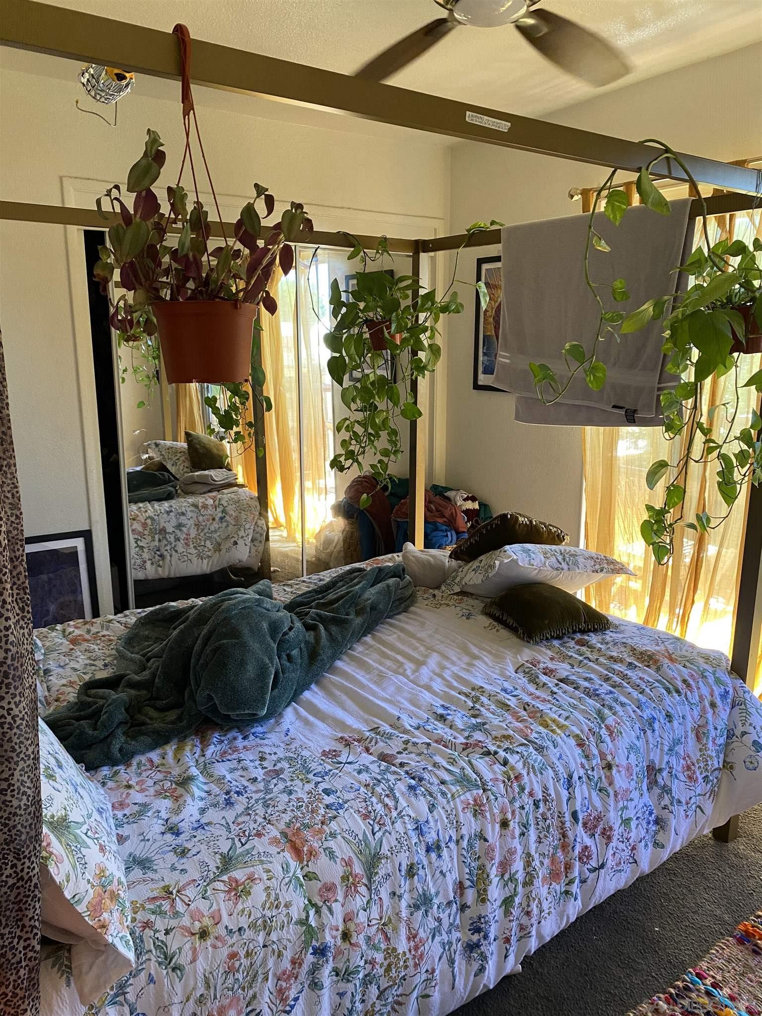 1141 Sumner Avenue El Cajon, CA 92021 - Photo 20 of 32 a bedroom with a bed window and mirror