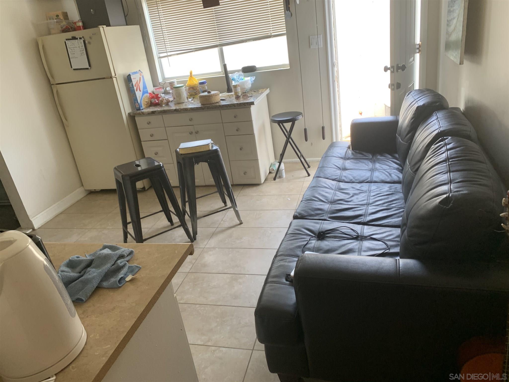 1141 Sumner Avenue El Cajon, CA 92021 - Photo 25 of 32 a living room with furniture and a fireplace