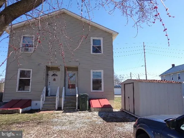 a backyard of a house with seating space