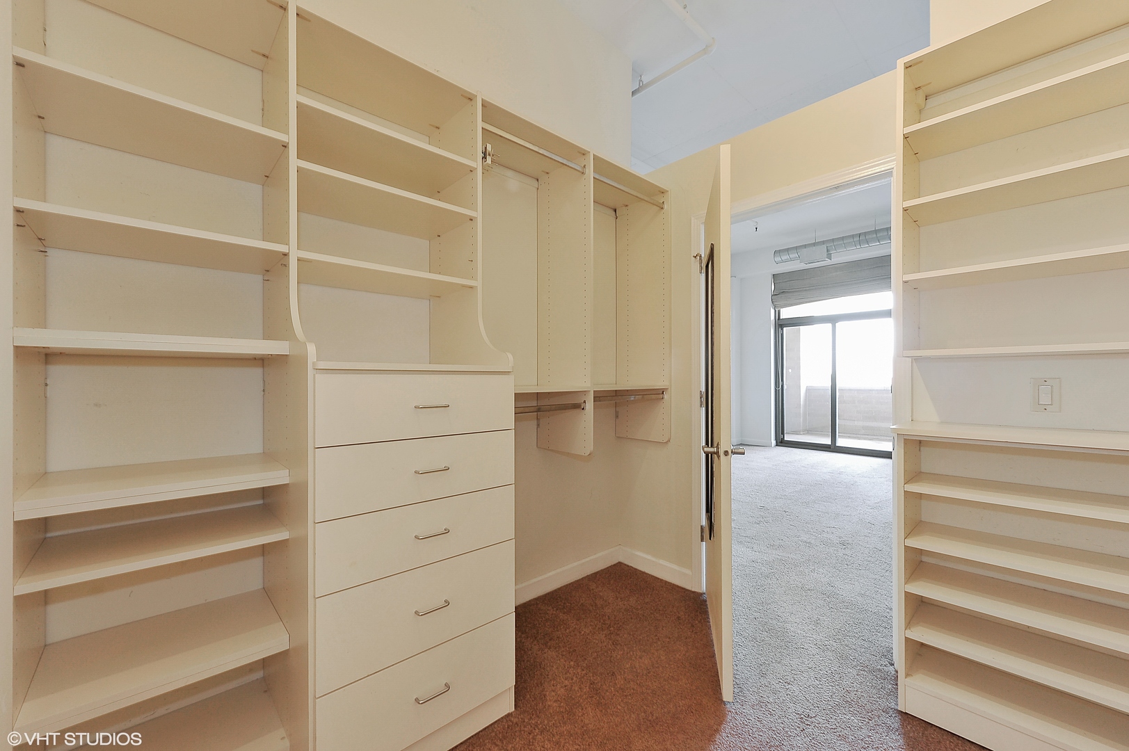 1301 West Madison Street, Unit 506 Chicago, IL 60607 - Photo 12 of 23 a view of walk in closet with empty racks
