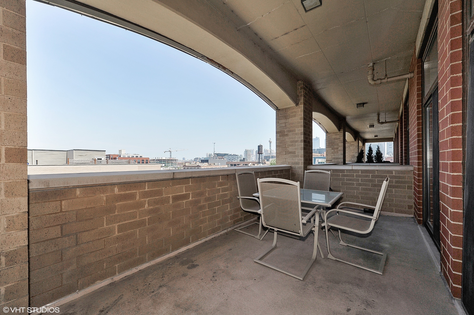 1301 West Madison Street, Unit 506 Chicago, IL 60607 - Photo 19 of 23 a view of a chairs and table in the terrace